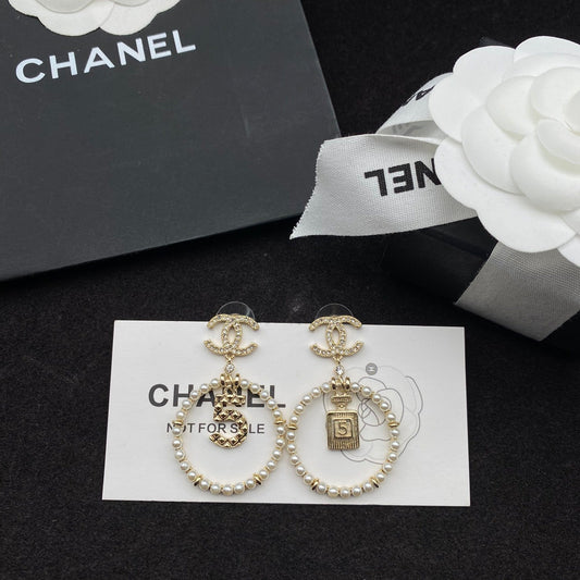 Boucles d'oreilles pendantes Perle et flacon de parfum Lucky 5