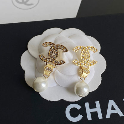Boucles d'oreilles pendantes diamant et perle