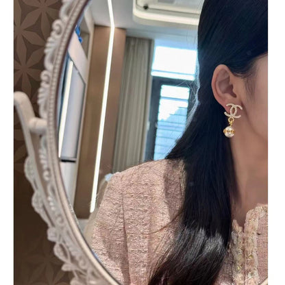 Boucles d'oreilles pendantes élégantes en perles