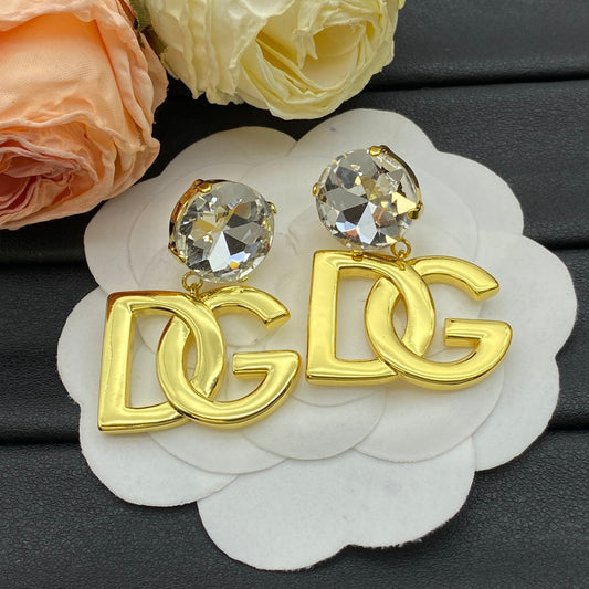 Boucles d'oreilles pendantes à logo doré