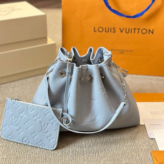 Sac seau à cordon en cuir gaufré bleu