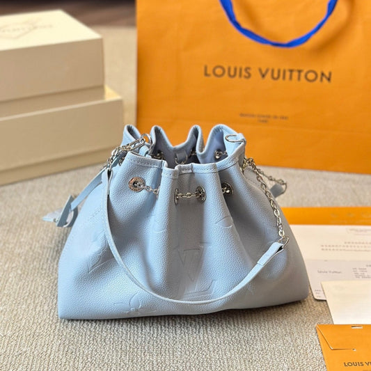 Sac seau à cordon en cuir gaufré bleu