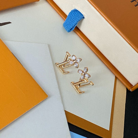 Boucles d'oreilles clous élégantes avec logo floral en cristal