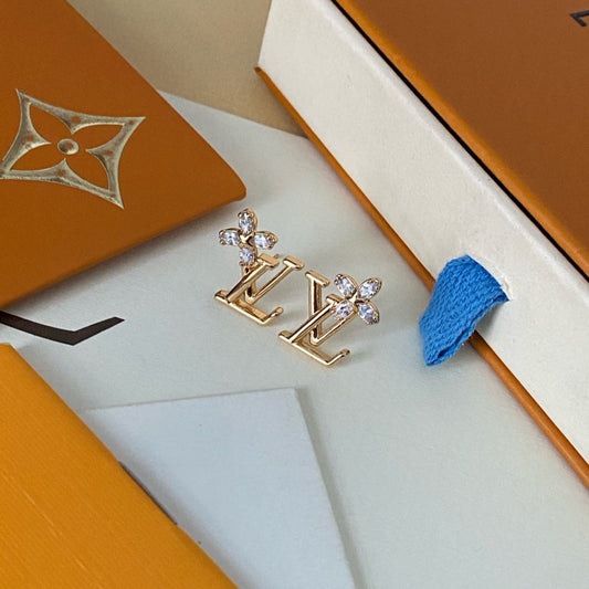 Boucles d'oreilles clous élégantes avec logo floral en cristal